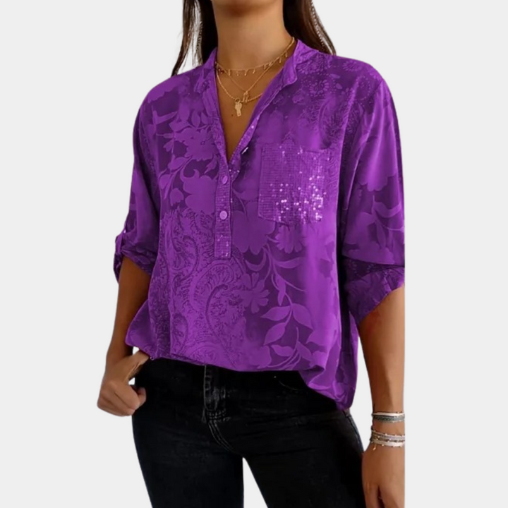 "Paarse damesblouse met bloemenpatroon en verstelbare mouwen voor veelzijdige, stijlvolle look."