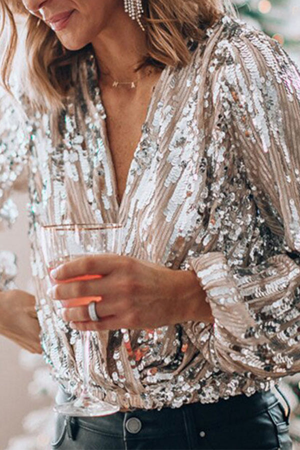 "Pailletten glamour blouse voor dames met V-hals en ballonmouwen, perfect voor feestelijke gelegenheden en elegante outfits."