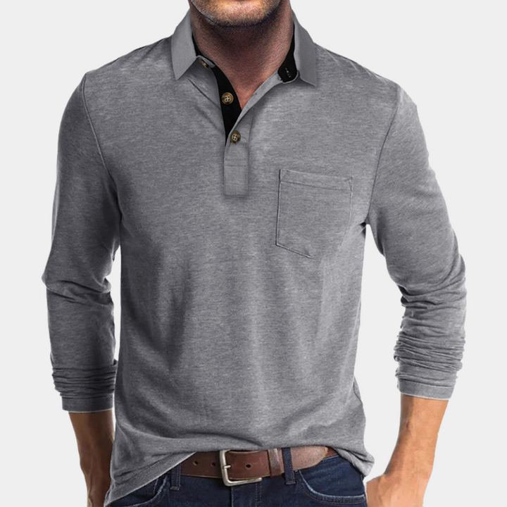 Poloshirt heren in blauw, elegante pasvorm, hoogwaardige stoffen, biedt comfort en stijl. Geschikt voor formele gelegenheden.