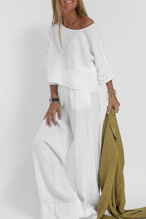 "Stijlvol katoen-linnen damespak, cropped top en wijde broek, licht ademend, ideaal voor zomer, modieus en comfortabel."