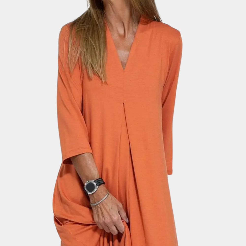 "Stijlvolle A-lijn damesjurk in oranje, zomerjurk met elegante snit. Comfortabele, veelzijdige jurk voor elke gelegenheid."