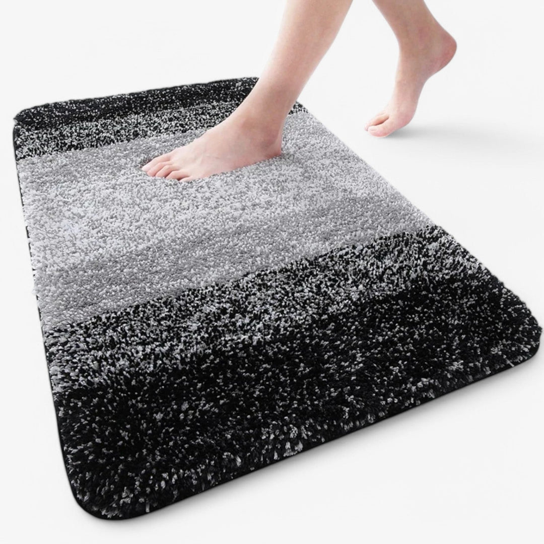 "Super absorberende antislip badmat met sneldrogende microvezels, zacht blauw oppervlak, ideaal voor badkamercomfort."