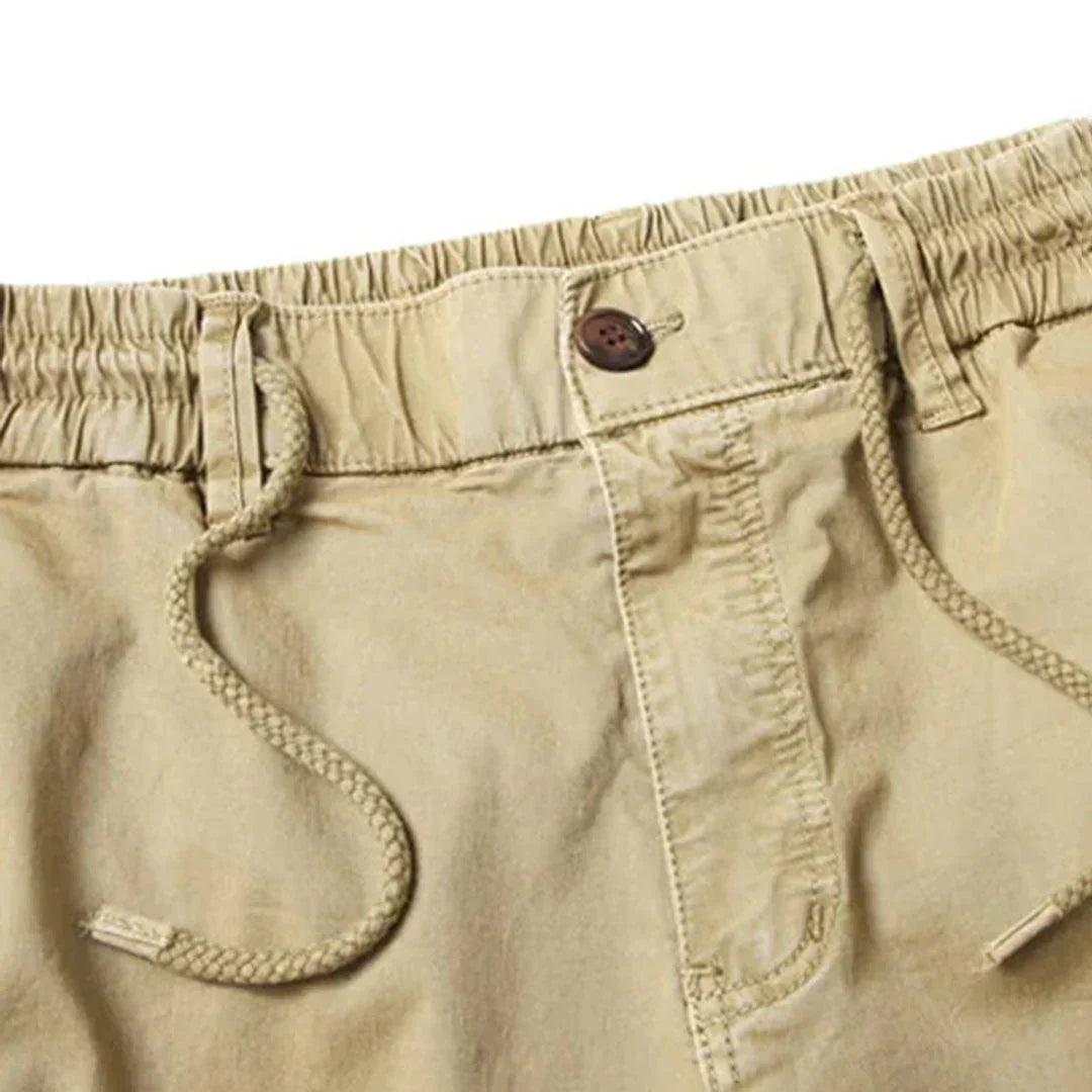 "Tactical cargo broek heren, duurzaam katoen, multifunctionele zakken, stoere streetwear stijl, comfortabele pasvorm."