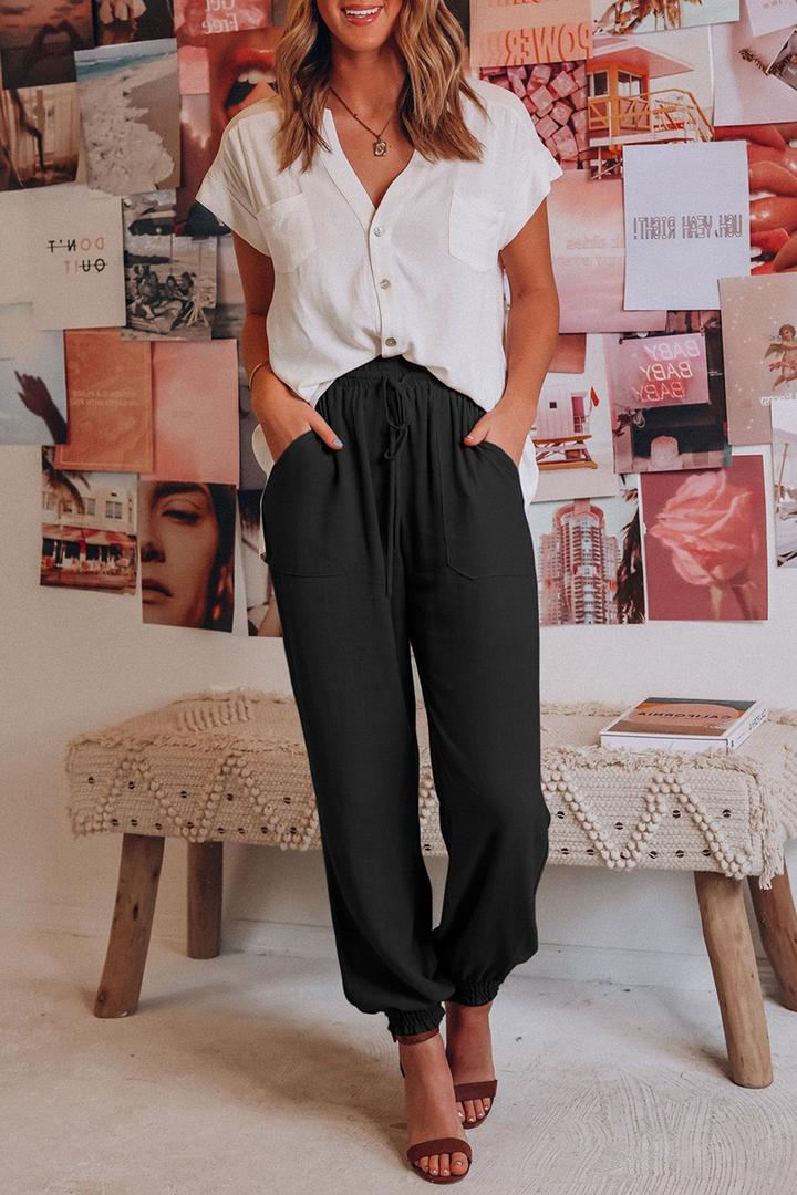 "Trendy dames harembroek, elastische tailleband, luchtig materiaal, losvallend bij heupen, taps toelopend naar enkels."