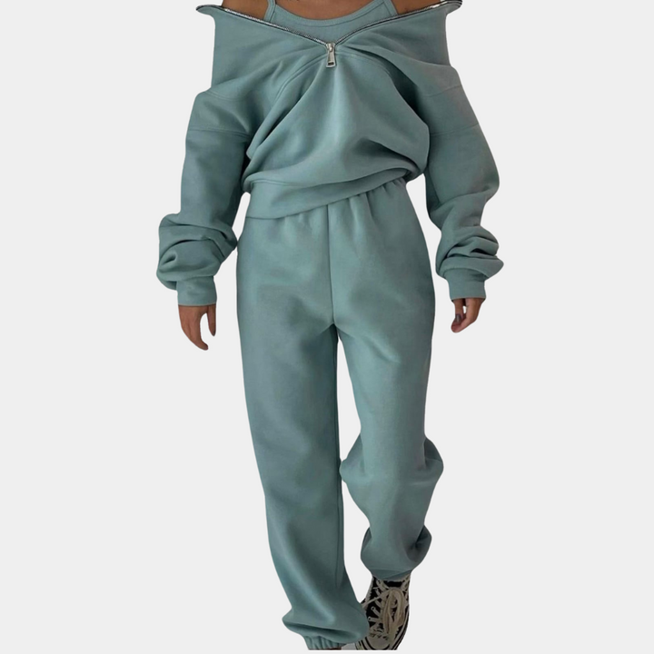 "Tweedelig dames joggingpak in groen, comfortabel met halve-rits vest en modieuze jogger, ideaal voor elke gelegenheid."