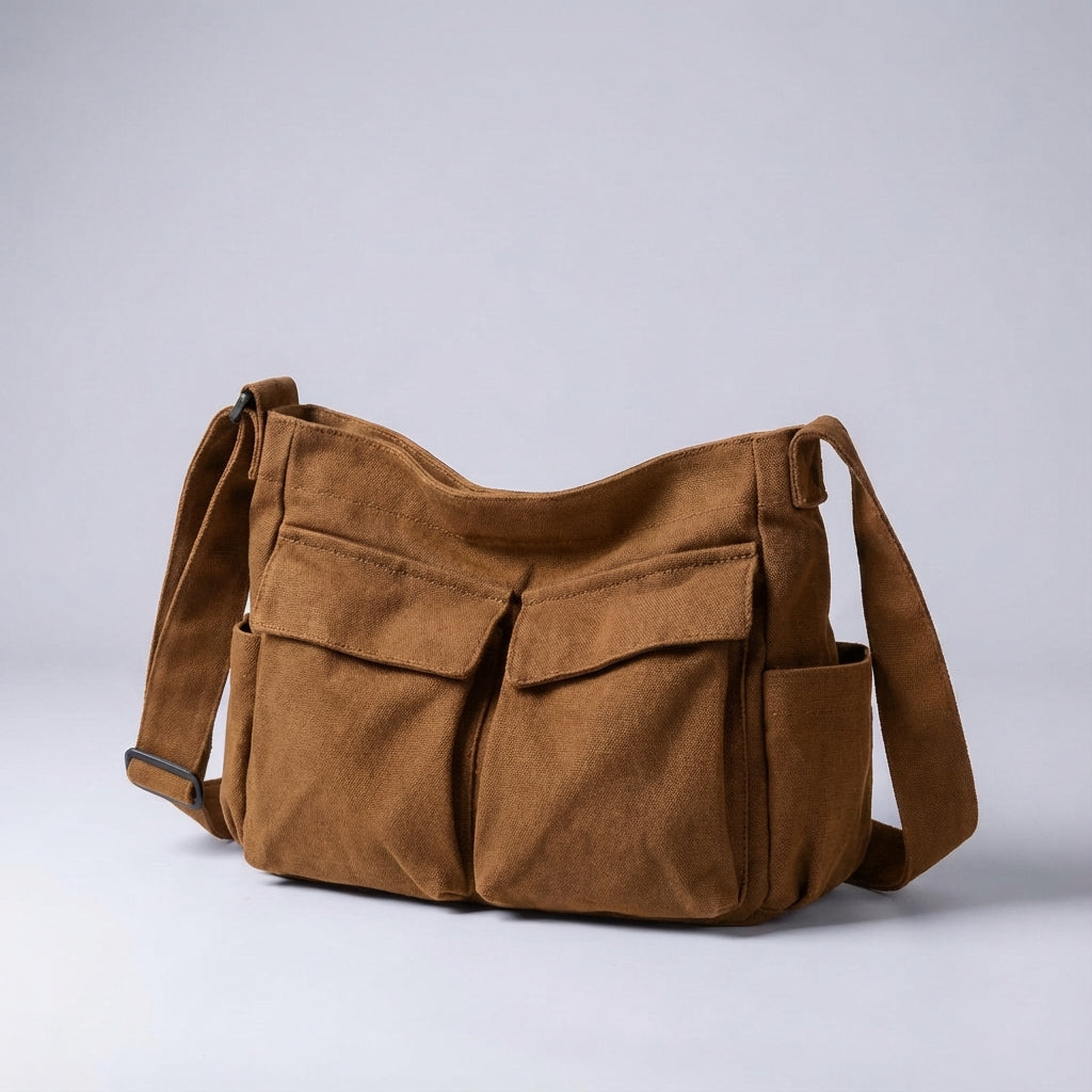 Draagcomfort met de Packlite schoudertas: een ruime canvastas met multivakken, casual en functioneel.
