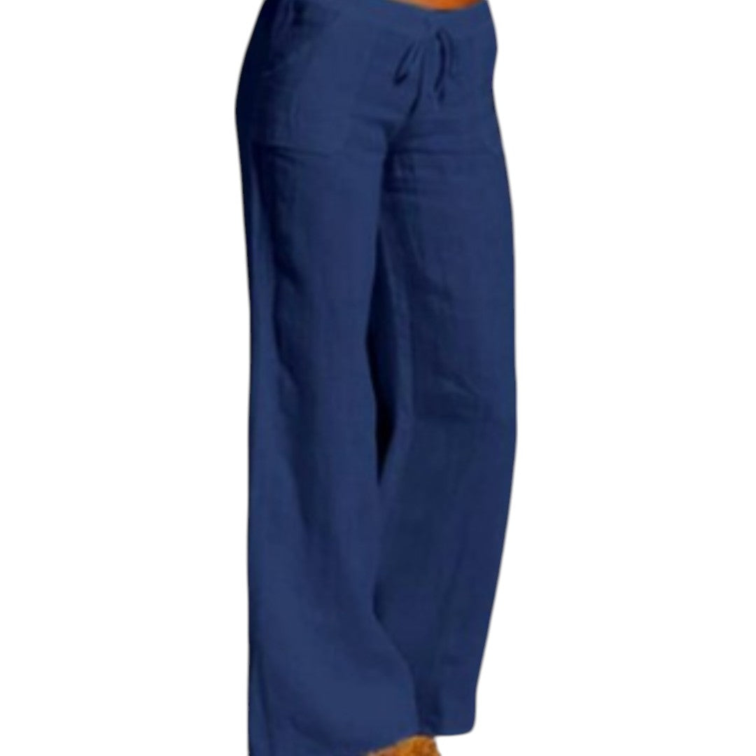 Vrouw draagt elegante, luchtige linnen broek met elastische taille in zwart. Perfect voor casual en formele gelegenheden.