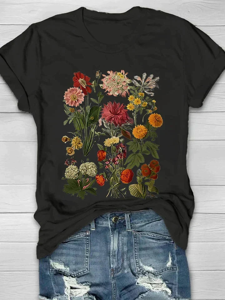 Vrouwen vintage shirt met levendige bloemenprint, korte mouwen & ronde hals. Elegante zomer top.
