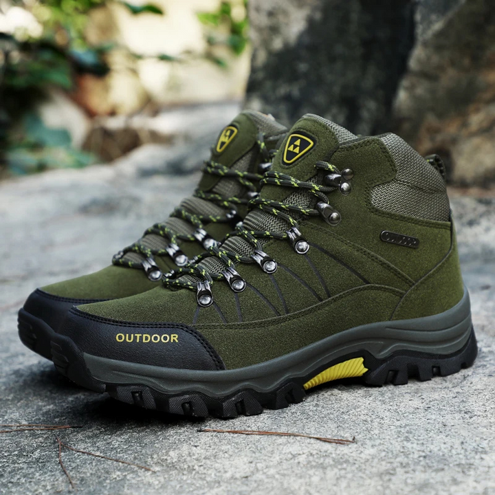 "Wandelschoenen heren, waterdicht en slipvast, robuust design in zwart-blauw; ideaal voor outdooractiviteiten."