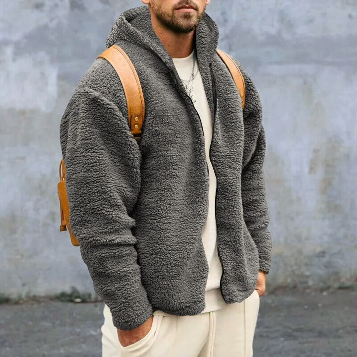 Marineblauw heren capuchonvest met rits, warm en comfortabel voor casual winterse momenten.