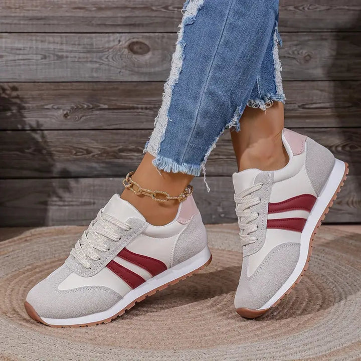 Stijlvolle grijze dames sneakers (retro stijl) met demping en voetboogondersteuning voor casual comfort.