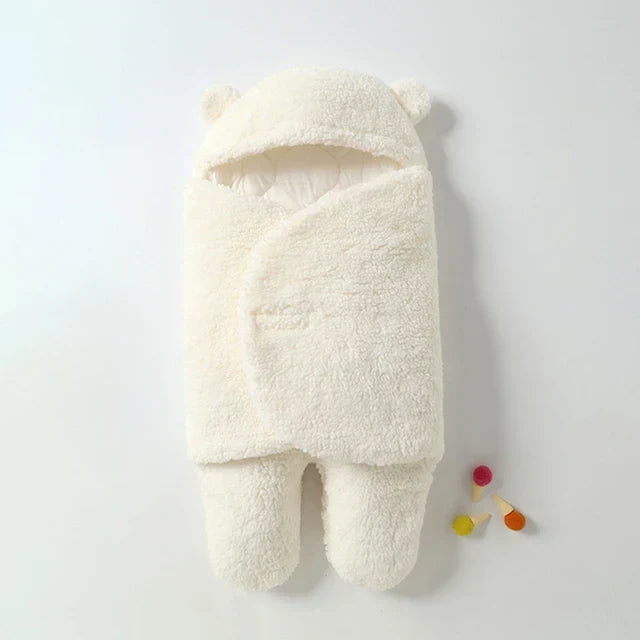 "Zachte baby wikkel deken in pasteltinten, houdt je baby warm en knus in de winter, gemaakt van huidvriendelijk materiaal."