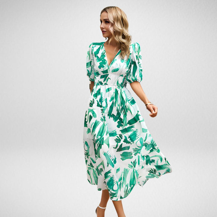 "Zomerse midi-jurk met vrolijke prints en pofmouwen, perfect voor zonnige dagen. Luchtige stof, elastische tailleband."