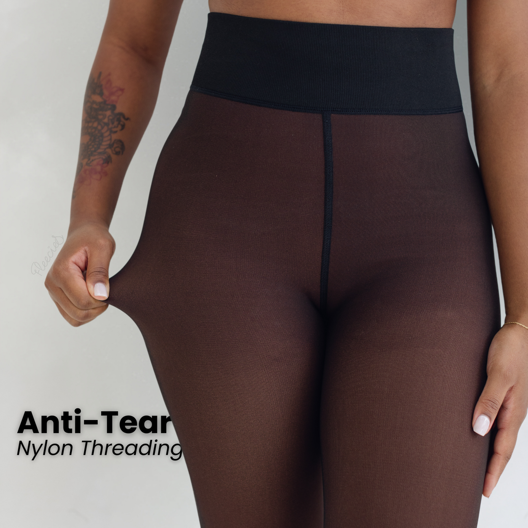 "Zwarte slimfit fleece panty met transparante look en vormend effect voor stijl en warmte in de koude maanden."