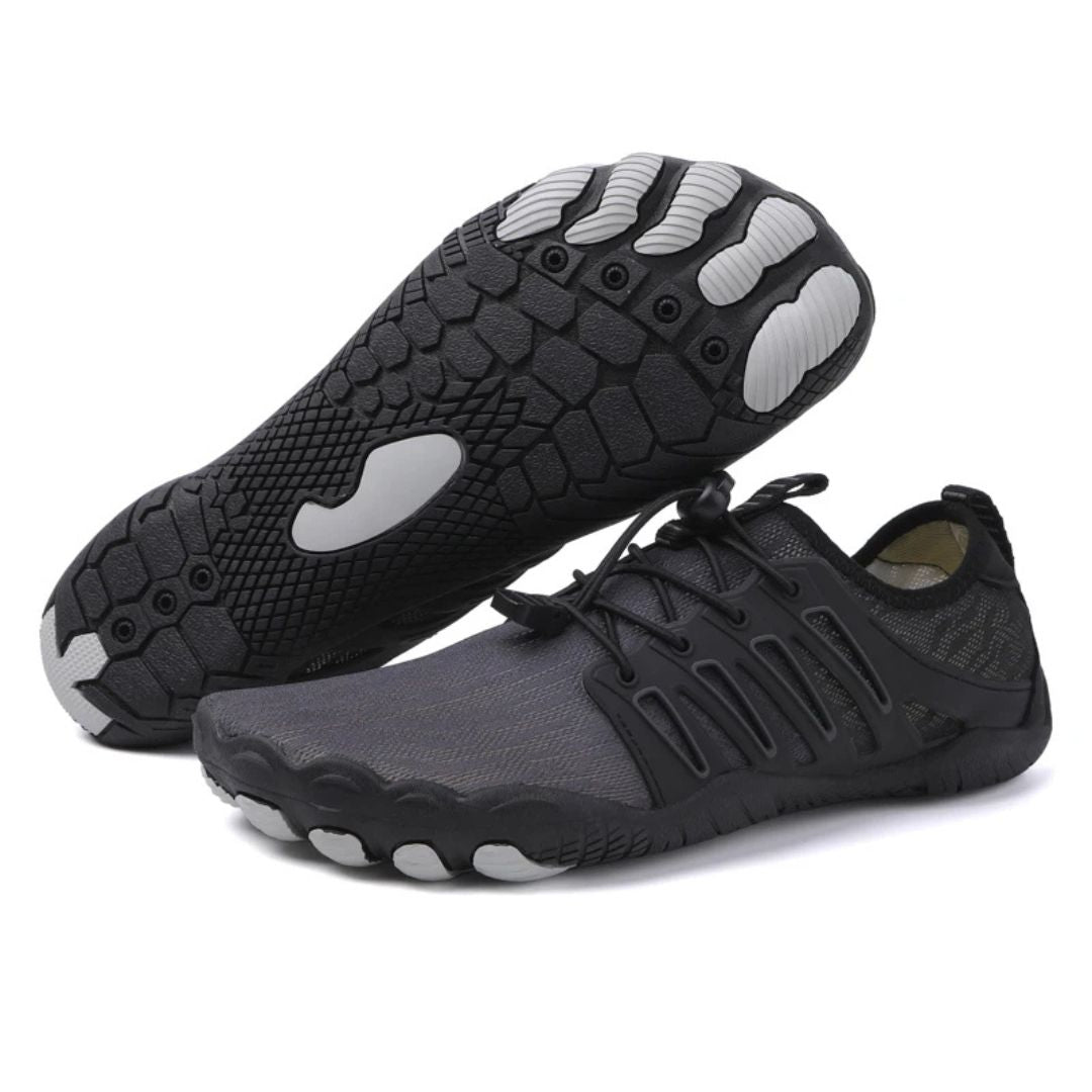 "Zwarte uniseks barefoot schoenen, orthopedisch design, ademend textiel, lichtgewicht, geschikt voor alle seizoenen."